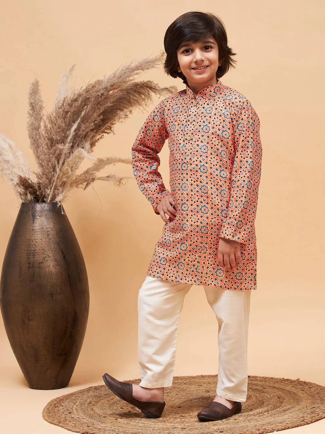 Jashvi Boy's Orange Printed Kurta And Cream Pyjama Set