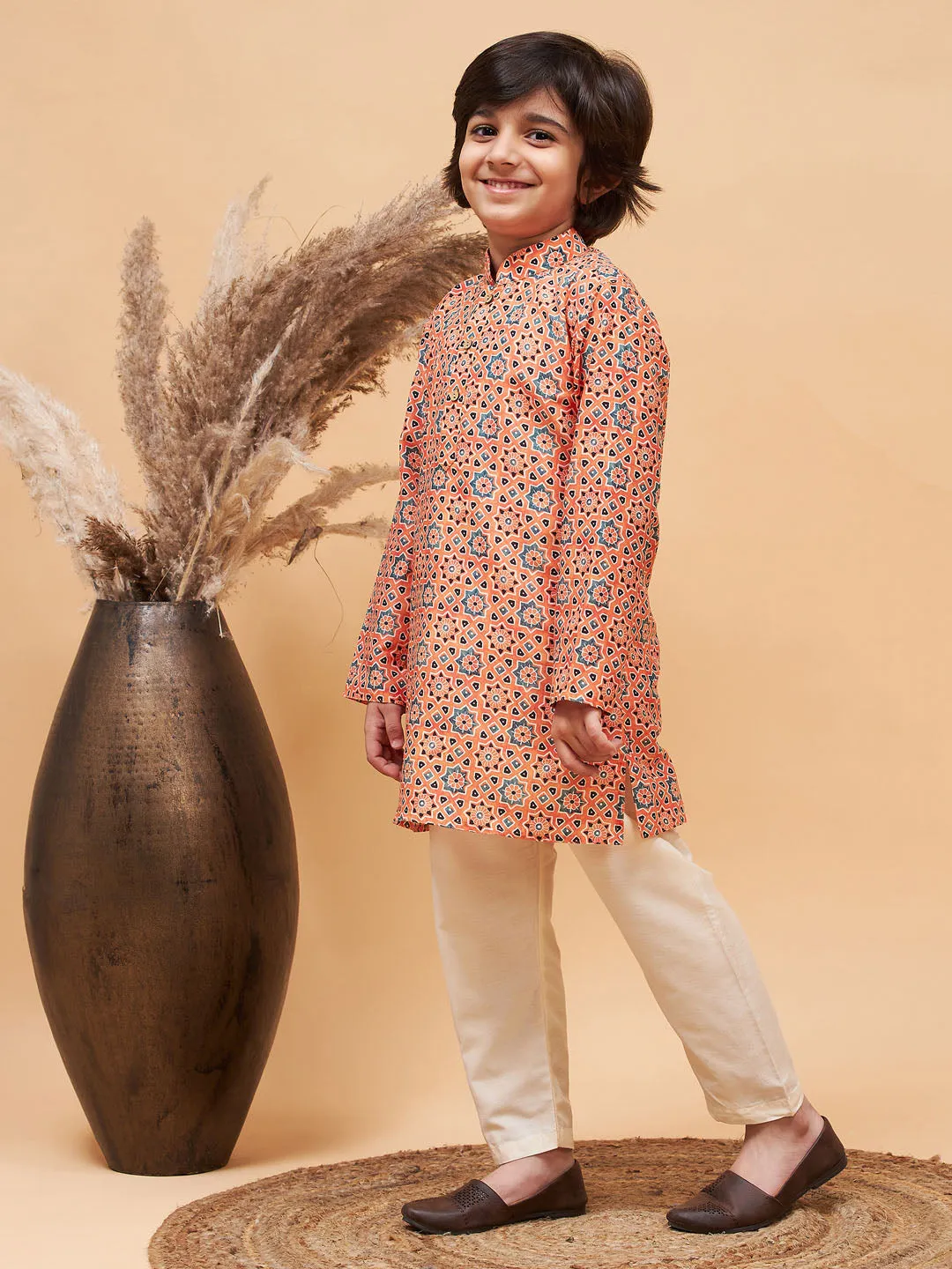 Jashvi Boy's Orange Printed Kurta And Cream Pyjama Set