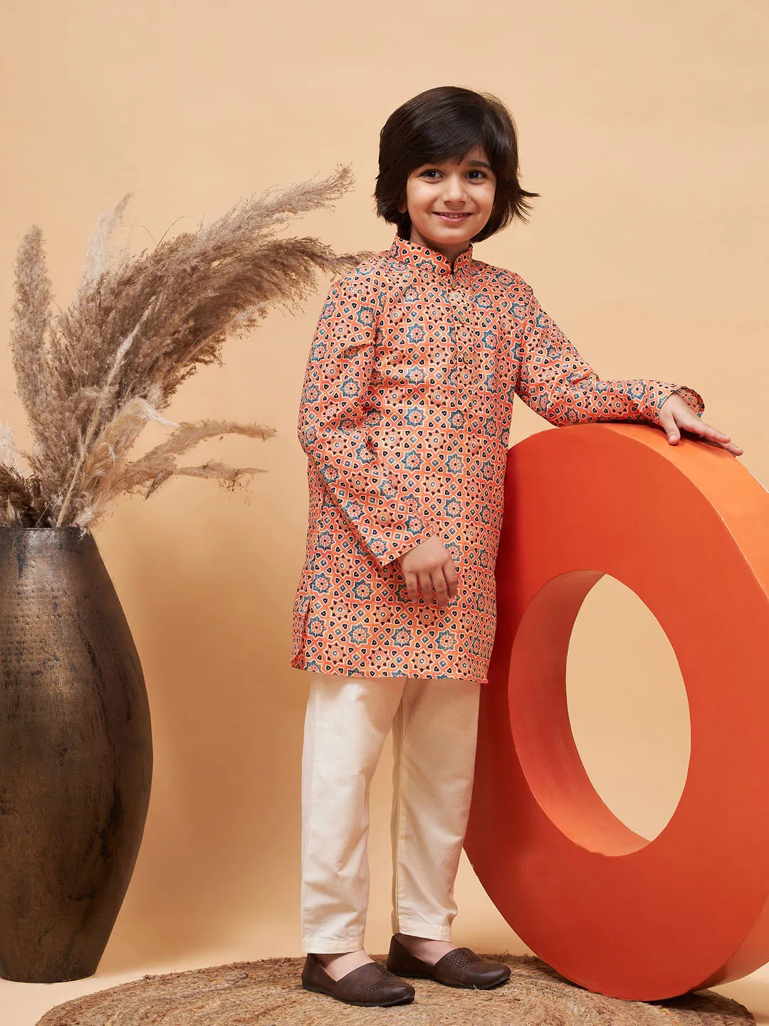 Jashvi Boy's Orange Printed Kurta And Cream Pyjama Set