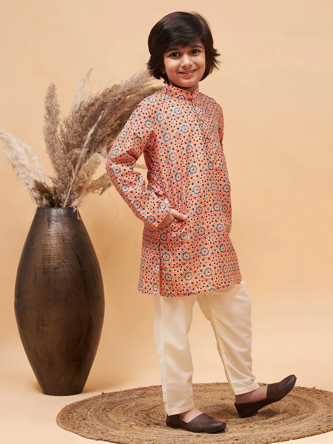 Jashvi Boy's Orange Printed Kurta And Cream Pyjama Set